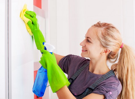 Living room house cleaning with organized supplies