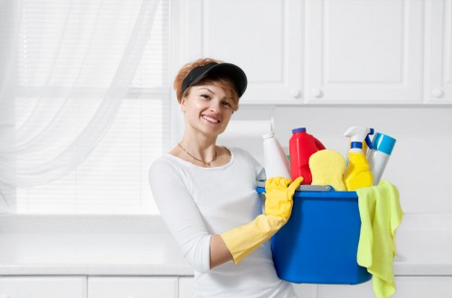 Cleaner vacuuming fine construction dust during after builders cleaning