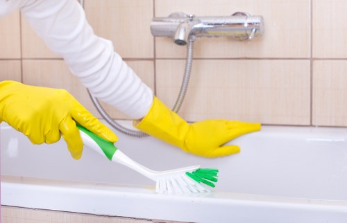 Essential house cleaning tools and products arranged neatly
