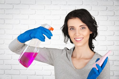 Cleaning team sanitizing desks and shared office surfaces